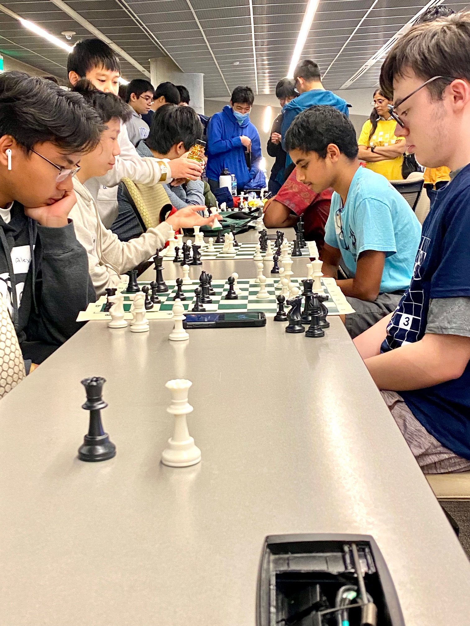 Alex Nguyen (left), a 10th grader at Providence Christian Academy, and Thomas George, a 12th grader at Sprayberry High School, play a timed chess match during Georgia Tech High School Math Day. (Photo Renay San Miguel)